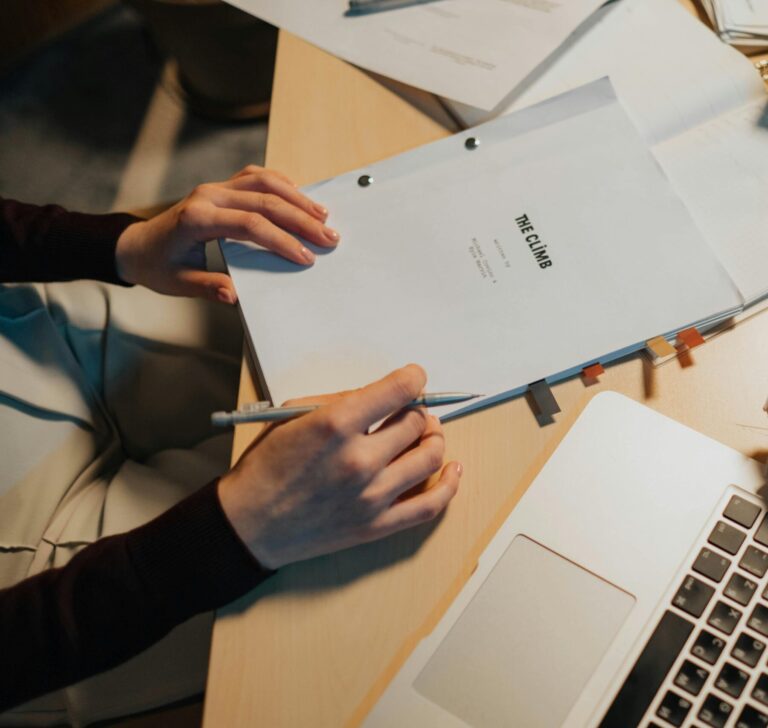 Cozy desk with screenplay, perfect for writing and research.
